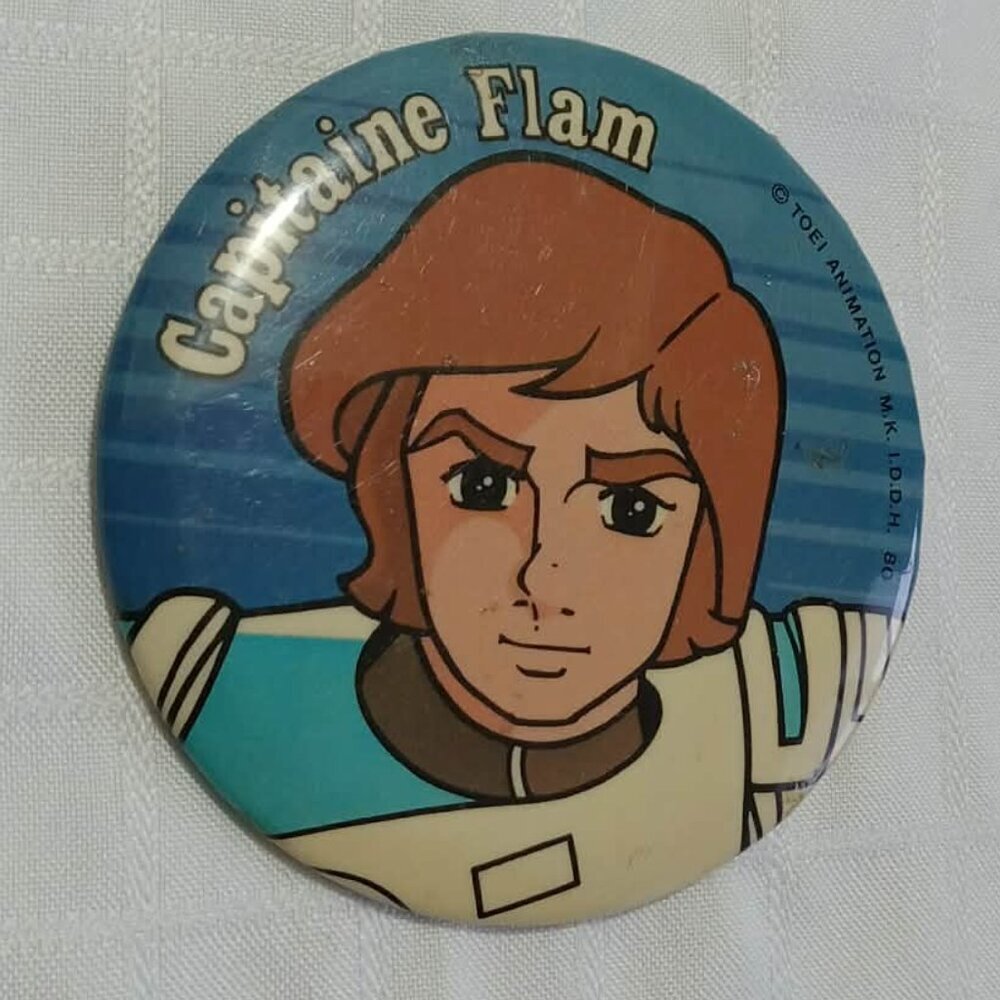 Strange & unusual vintage button pins featuring Capitaine Flam